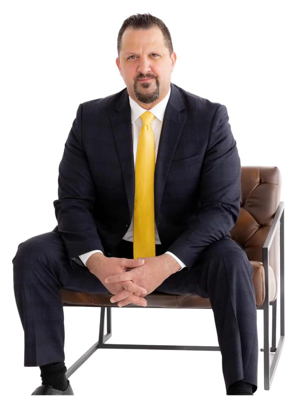 Tony Kurtulan, founder and CEO of TK Sales Group, seated in a navy suit